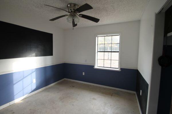 6047 Eden Square Crestview, FL 32539 - Photo 23 of 39 wooden floor in an empty room with a window