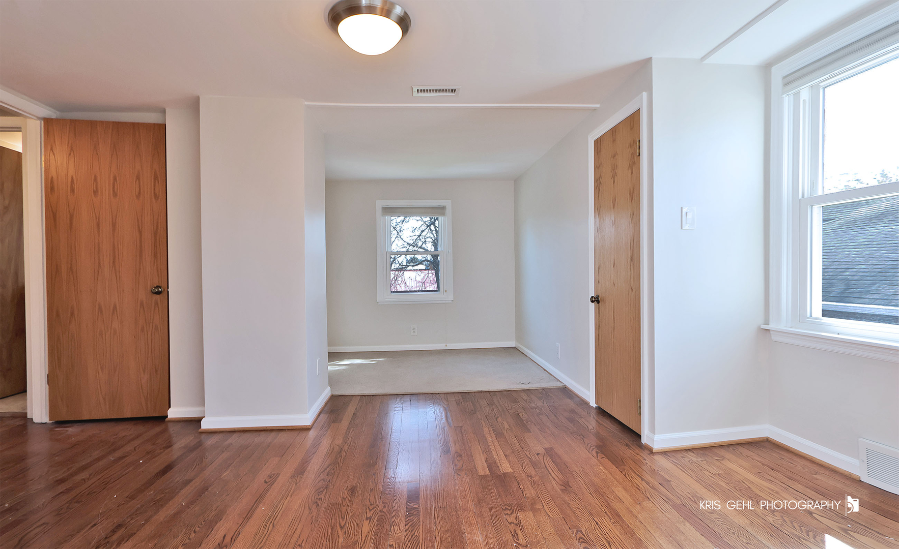 275 Harding Street Grayslake, IL 60030 - Photo 14 of 25 an empty room with wooden floor and windows