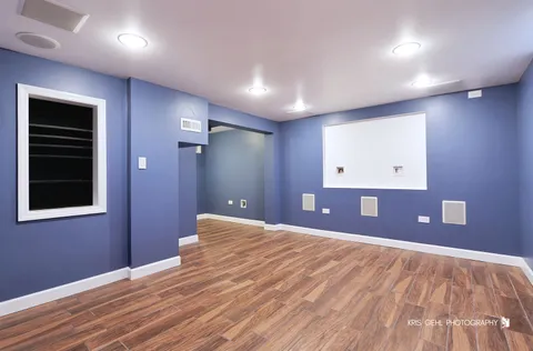 a view of a livingroom with a hall and wooden floor