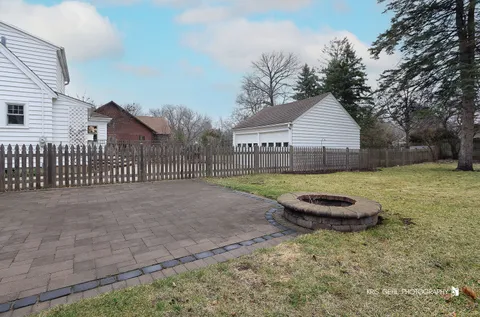 a view of a backyard with a trampoline