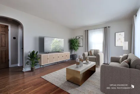 a living room with furniture potted plant and window
