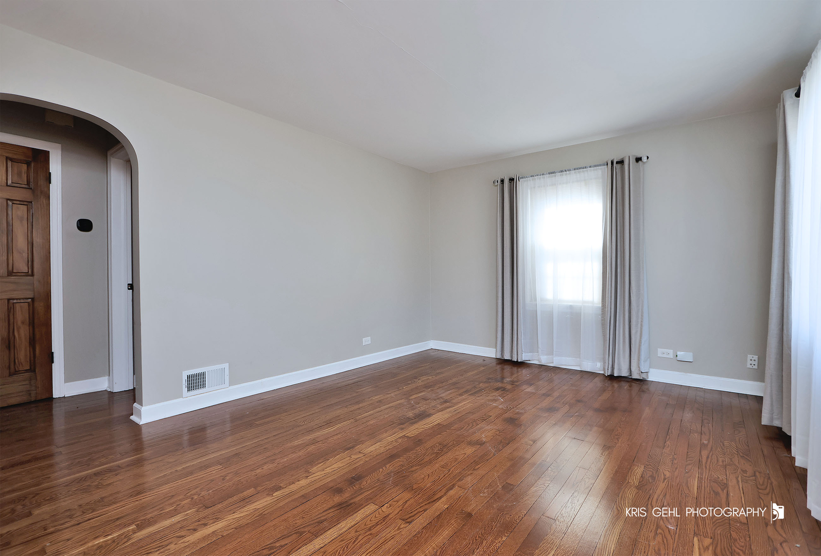 275 Harding Street Grayslake, IL 60030 - Photo 4 of 25 an empty room with wooden floor and windows