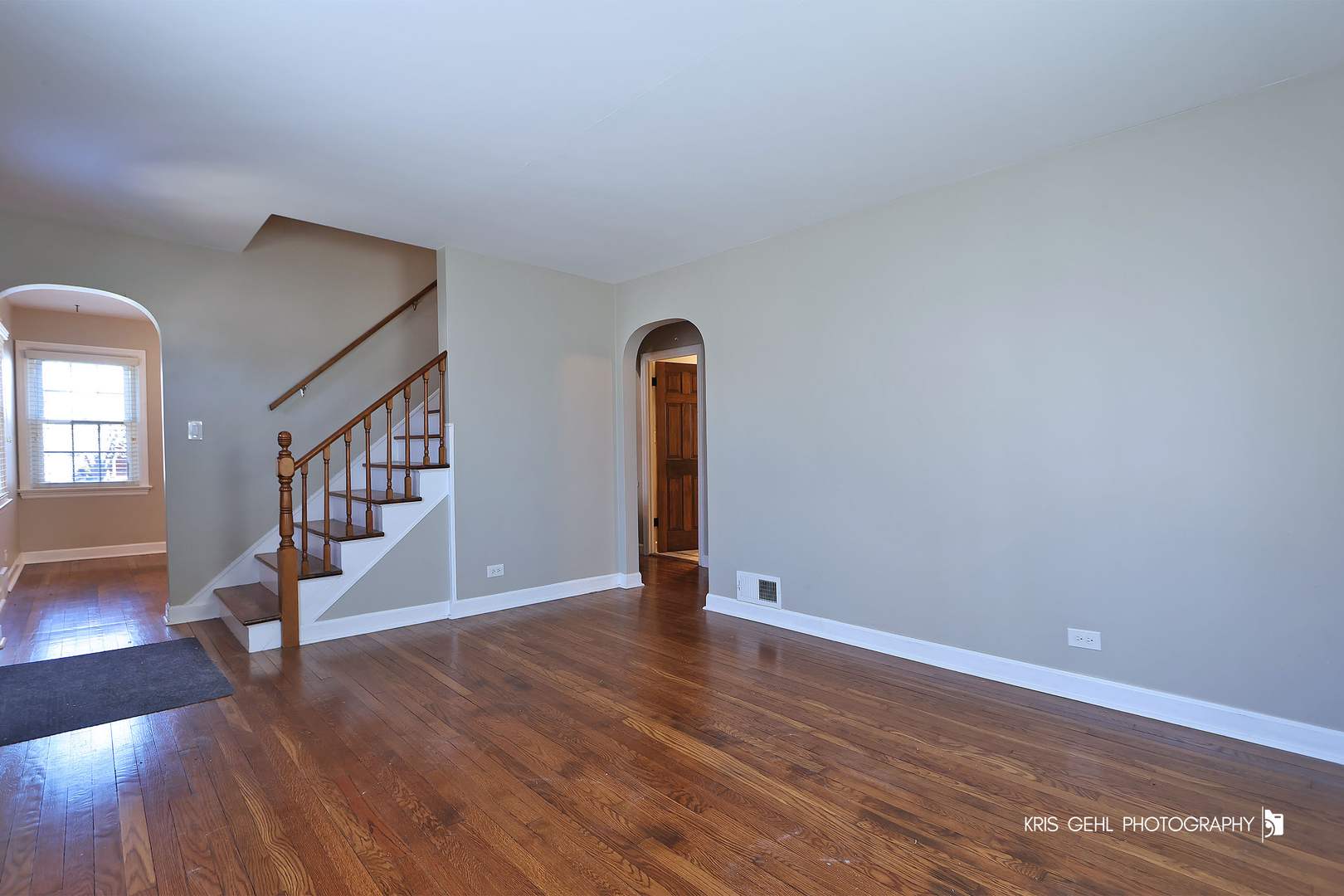 275 Harding Street Grayslake, IL 60030 - Photo 5 of 25 a view of an empty room with wooden floor and a potted plant