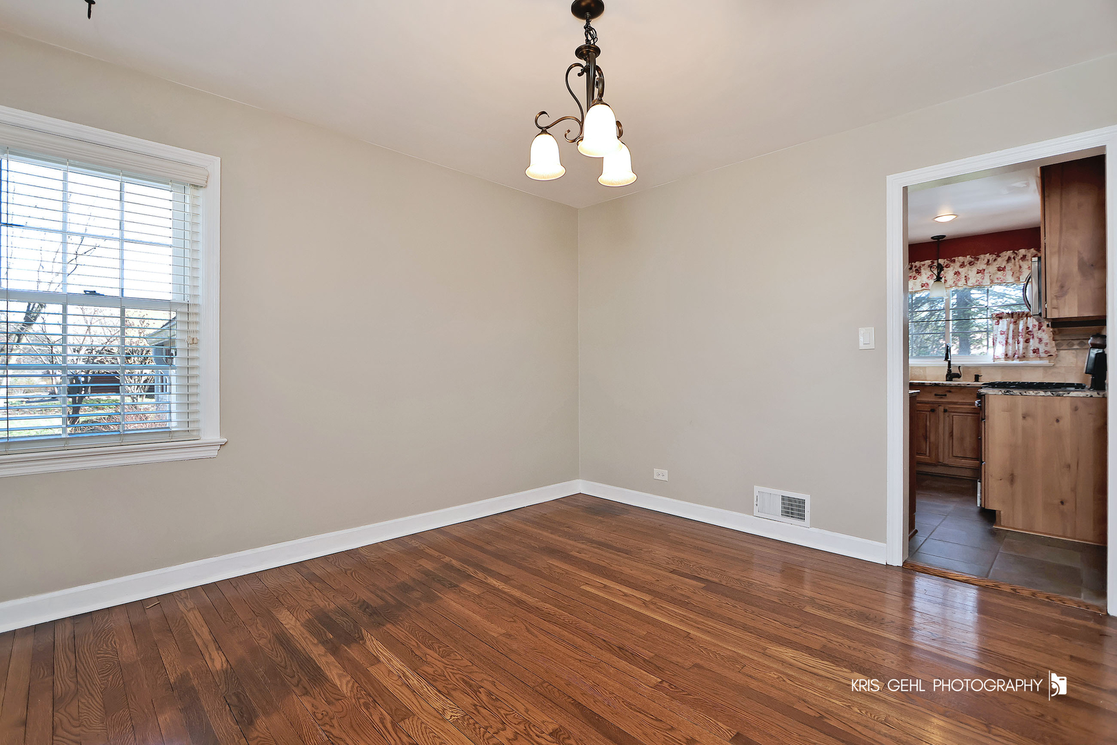 275 Harding Street Grayslake, IL 60030 - Photo 7 of 25 a view of a room with wooden floor and windows