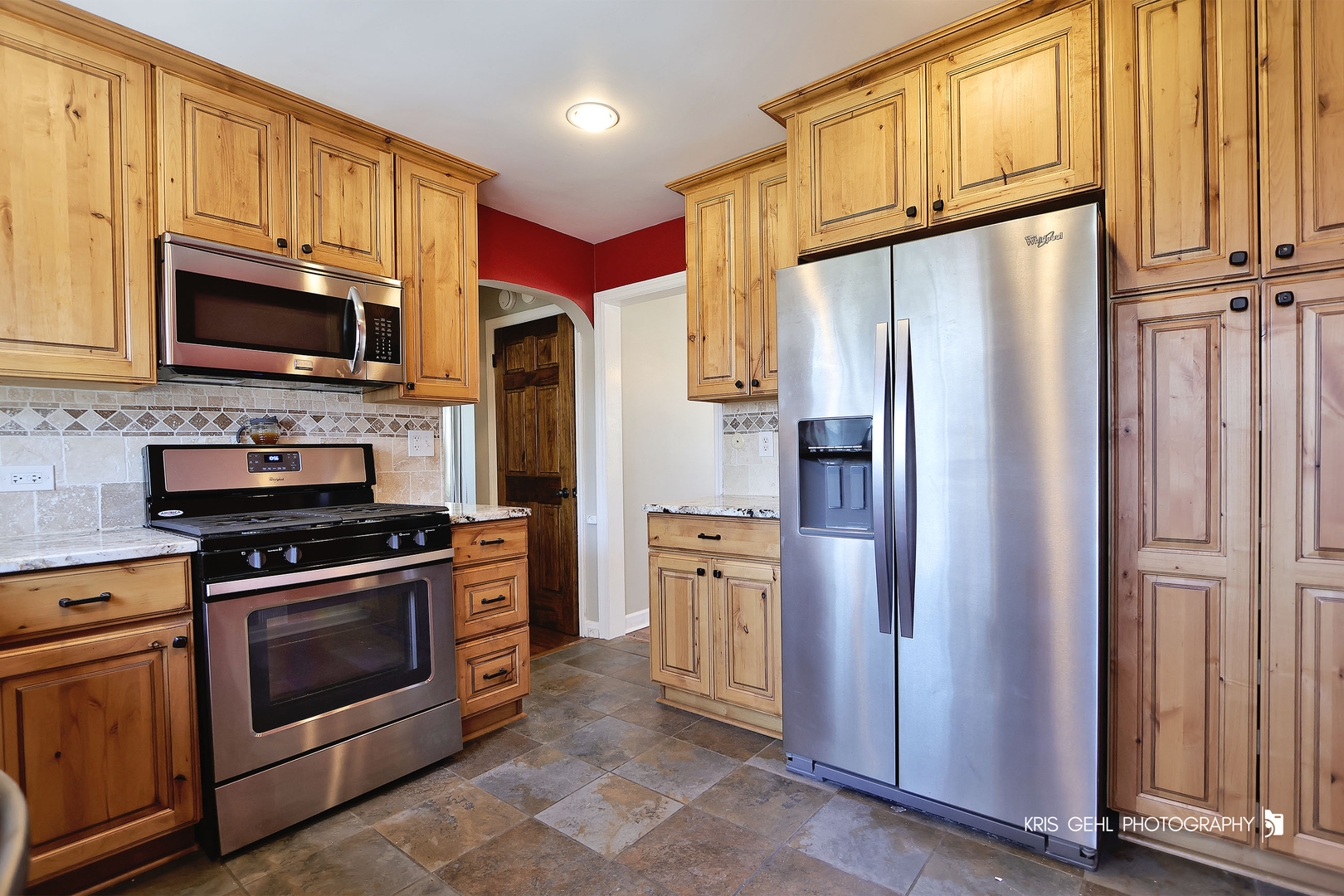 275 Harding Street Grayslake, IL 60030 - Photo 9 of 25 a kitchen with stainless steel appliances granite countertop a refrigerator stove and microwave