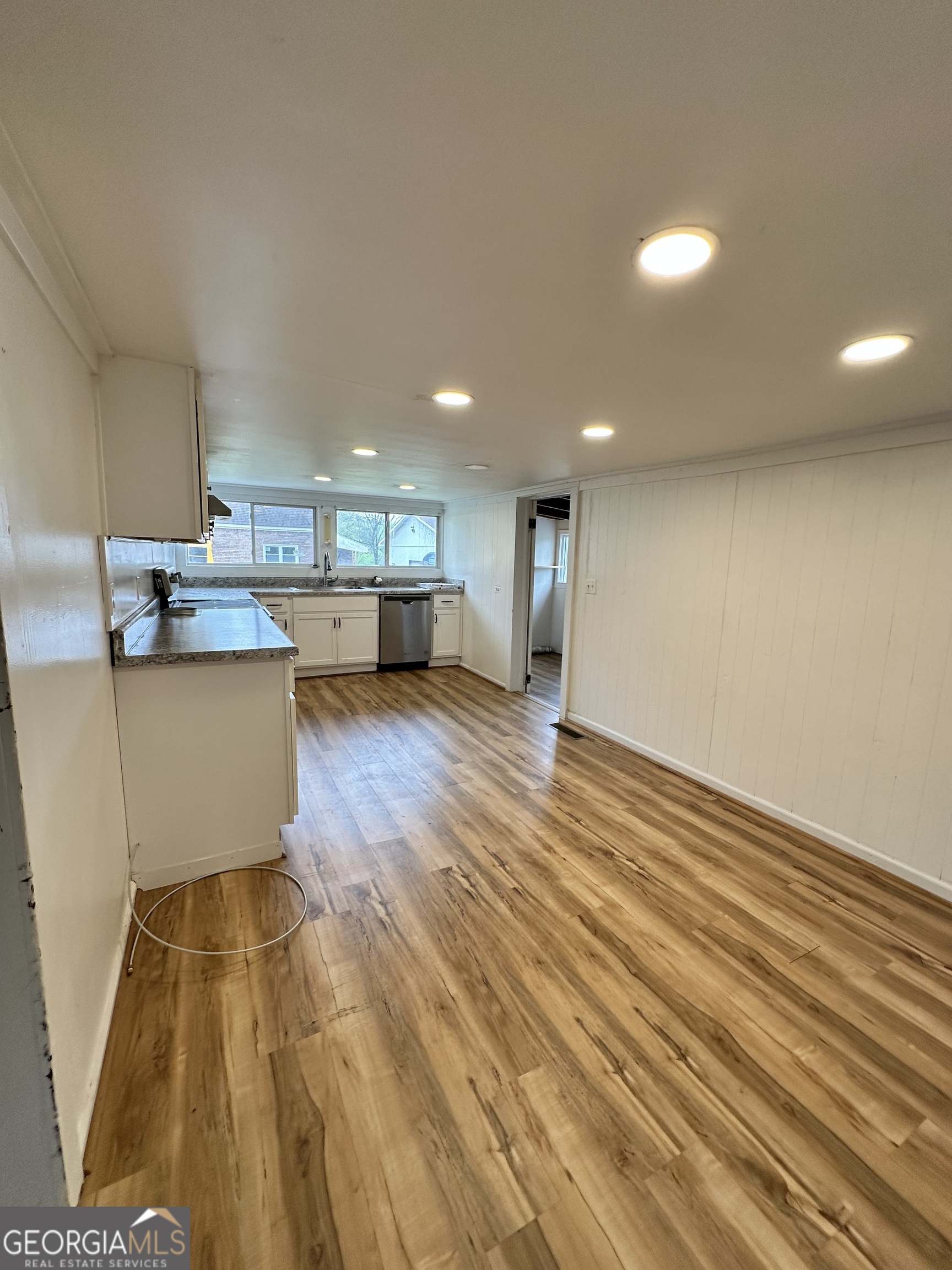 55 Bowdon Street Waco, GA 30182 - Photo 11 of 18 a view of kitchen with cabinets and wooden floor