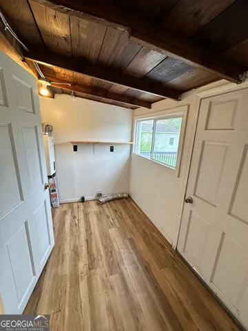 a view of a room with wooden floor and stairs