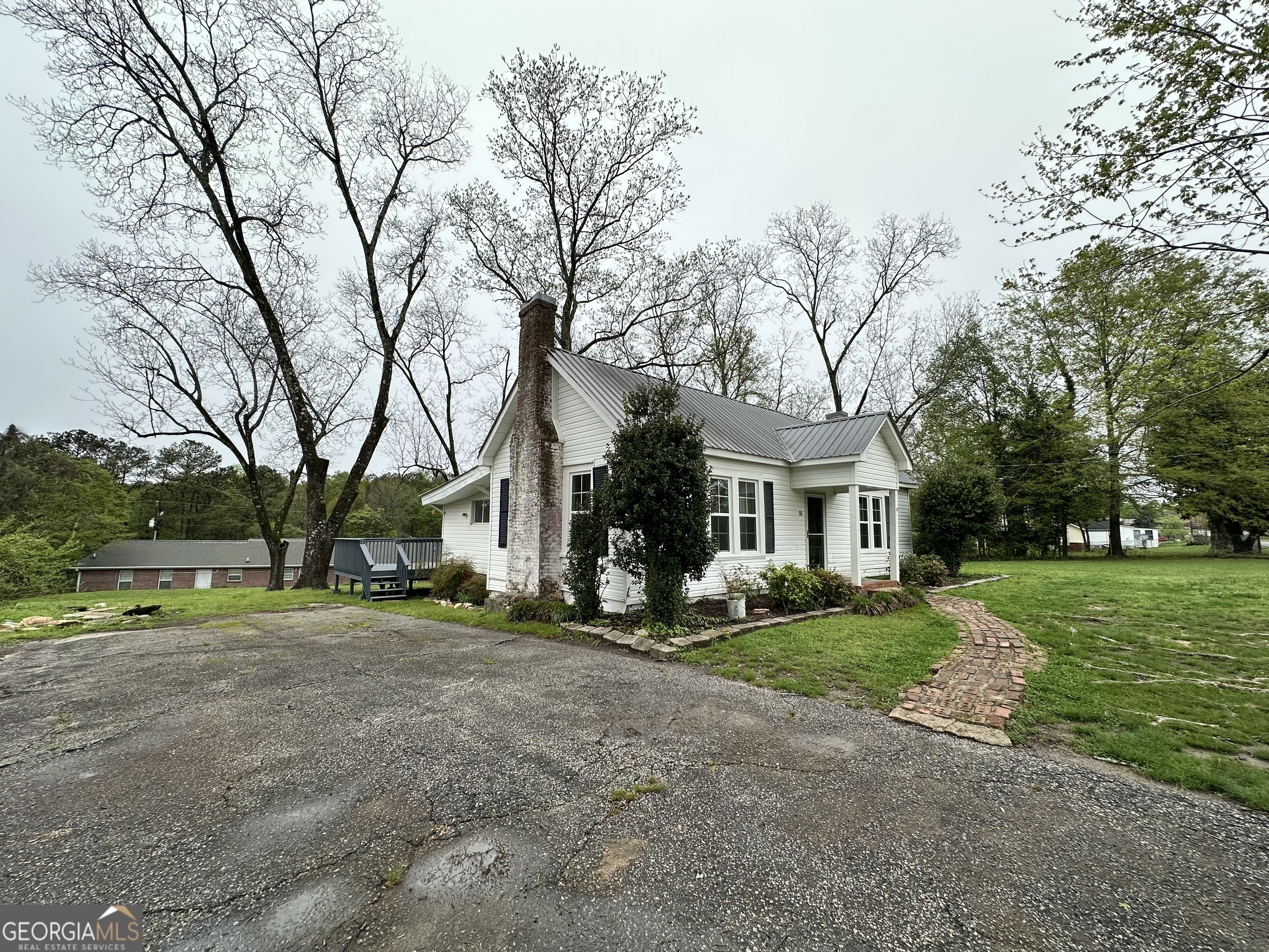 55 Bowdon Street Waco, GA 30182 - Photo 2 of 18 a view of a house with a yard