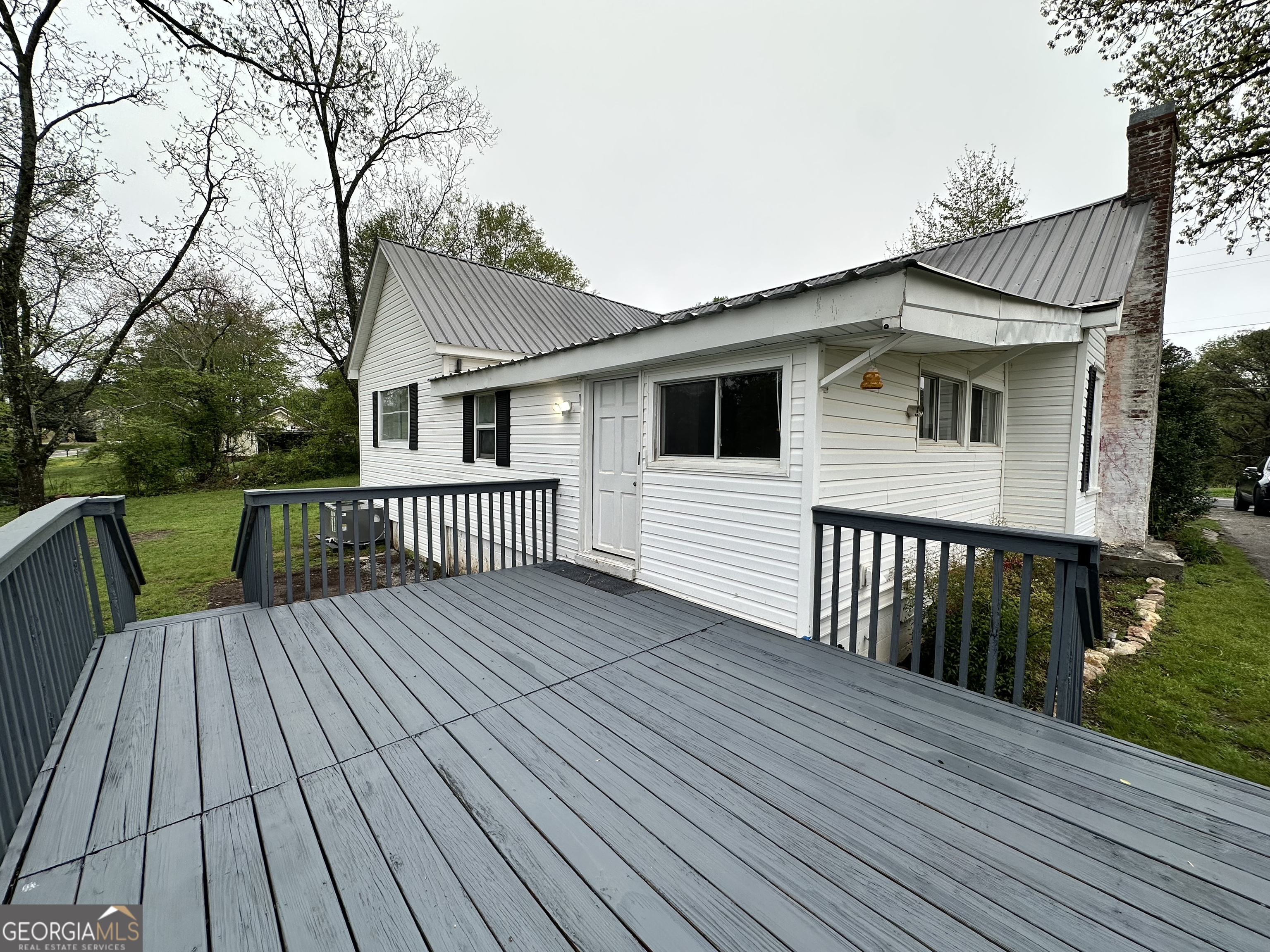 55 Bowdon Street Waco, GA 30182 - Photo 7 of 18 a view of a house with wooden deck