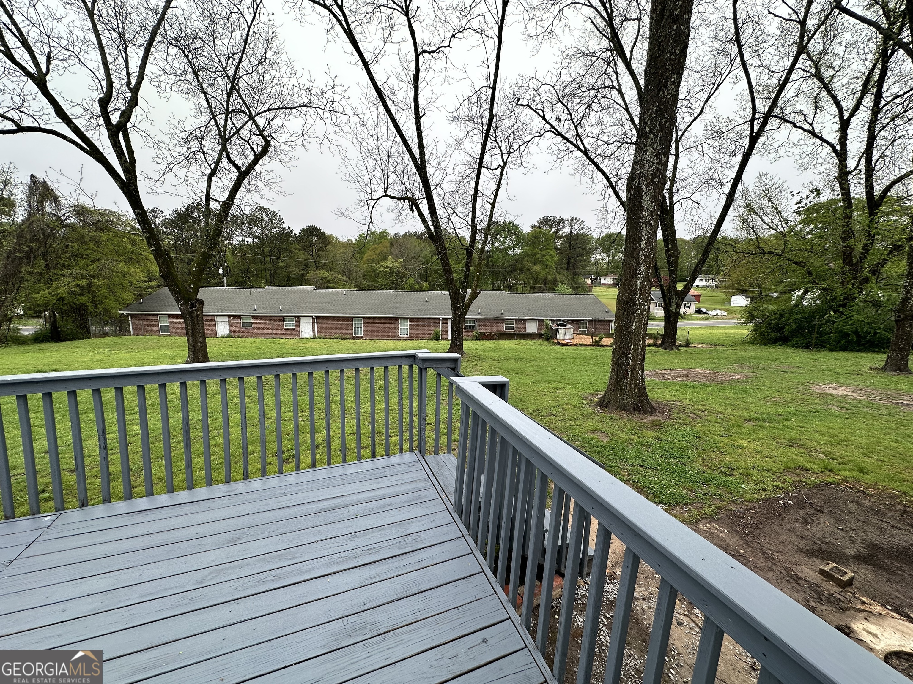 55 Bowdon Street Waco, GA 30182 - Photo 8 of 18 a view of deck with a backyard