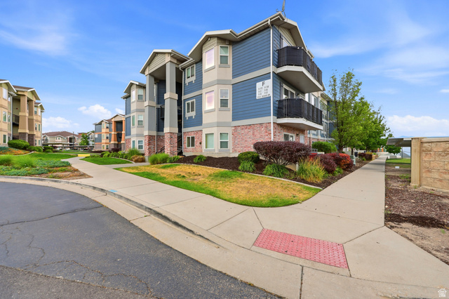 116 East Resaca Drive, Unit F6 Sandy, UT 84070 - Photo 2 of 32 Multi-story residential building with blue siding and brick veneer