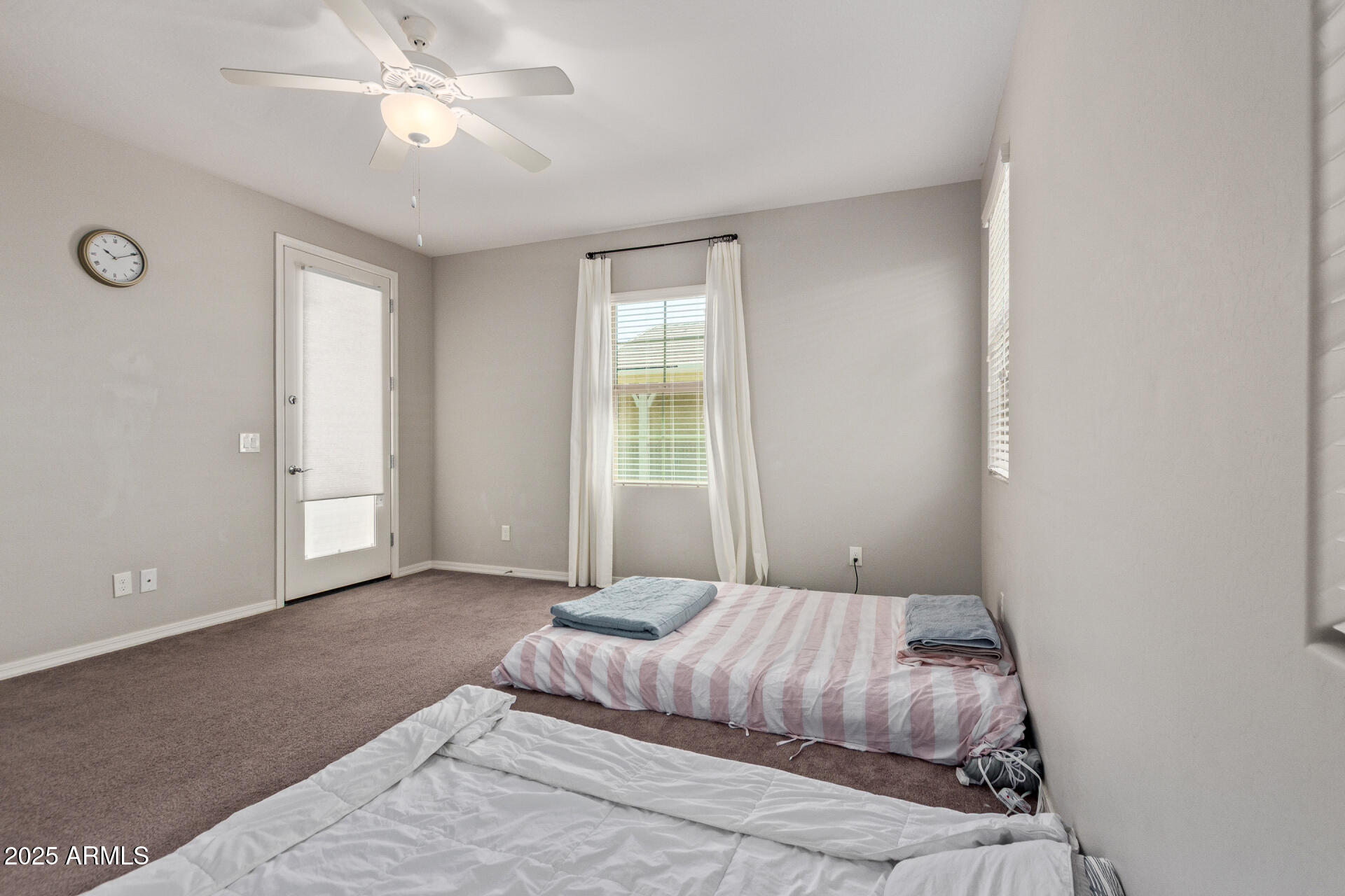 3934 East Turley Street Gilbert, AZ 85295 - Photo 14 of 37 a bedroom with a bed and a chandelier