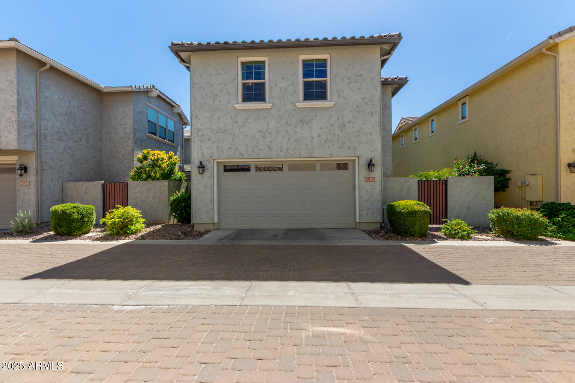 3934 East Turley Street Gilbert, AZ 85295 - Photo 23 of 37 a front view of a house with a yard and a garage