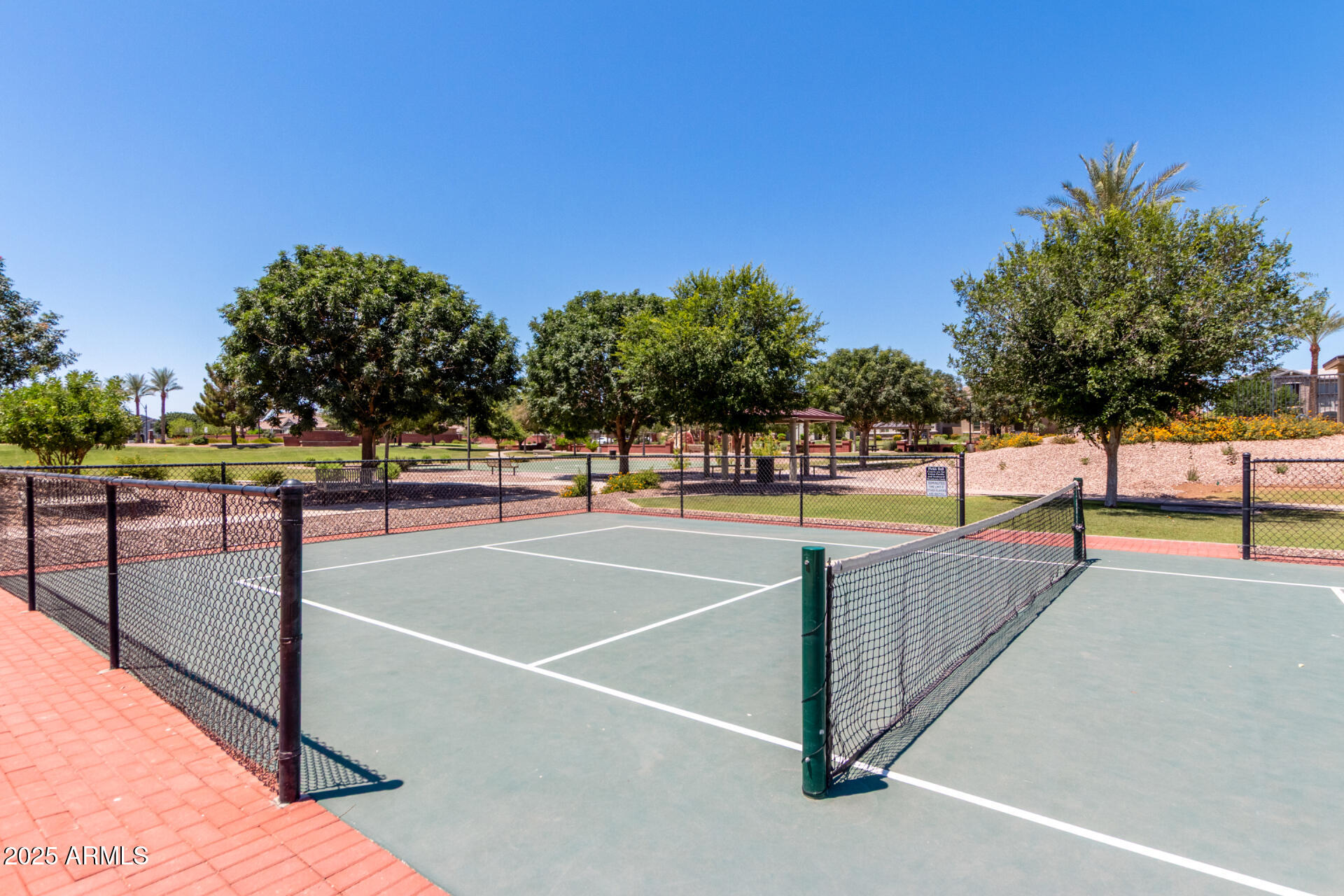 3934 East Turley Street Gilbert, AZ 85295 - Photo 31 of 37 a view of tennis court with trees in the background