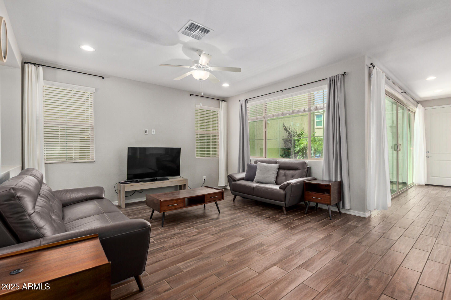 3934 East Turley Street Gilbert, AZ 85295 - Photo 5 of 37 a living room with furniture and a flat screen tv
