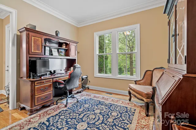 a workspace with lounge chair and a window