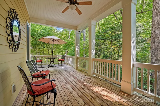 a view of balcony with wooden floor and outdoor seating