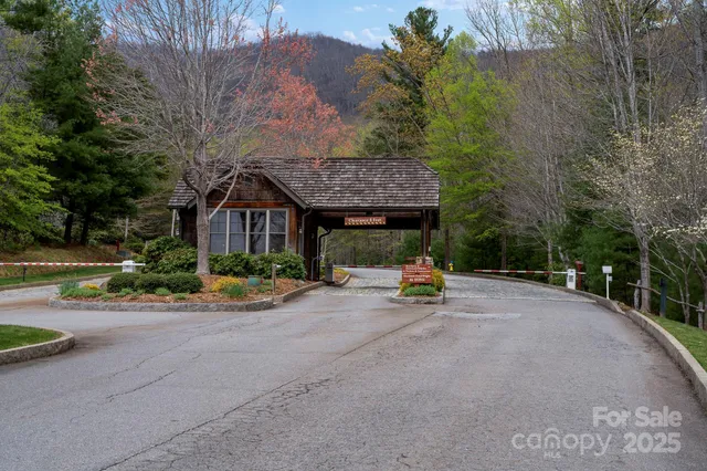 a view of a house with yard and sitting area