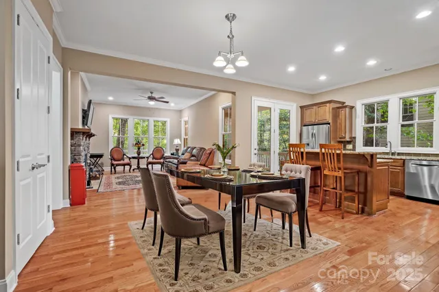 a view of a dining area with furniture window and wooden floor
