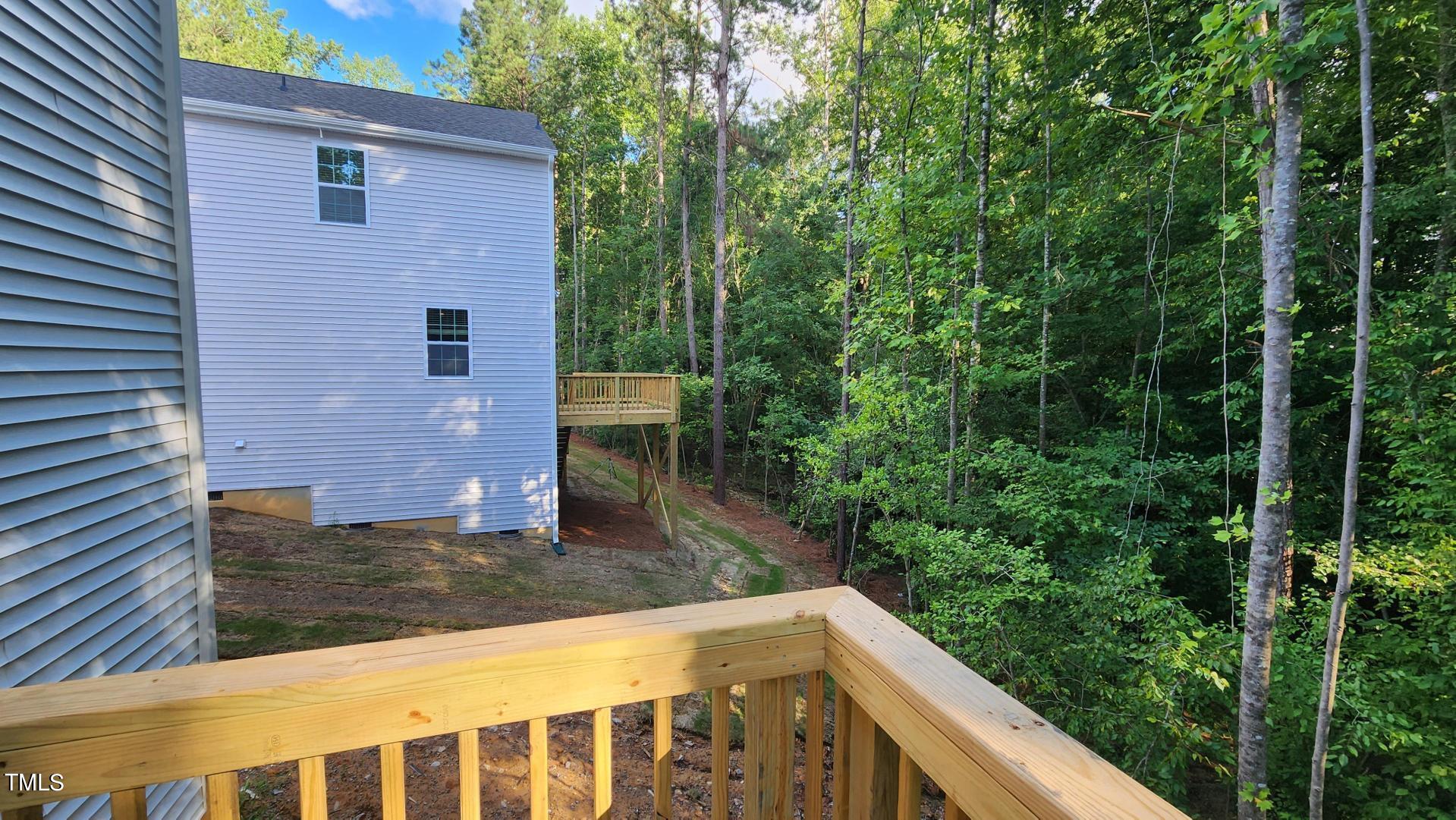 3125 White Memorial Church Road Willow Spring, NC 27592 - Photo 49 of 56 120 SF deck facing wooded private backyard