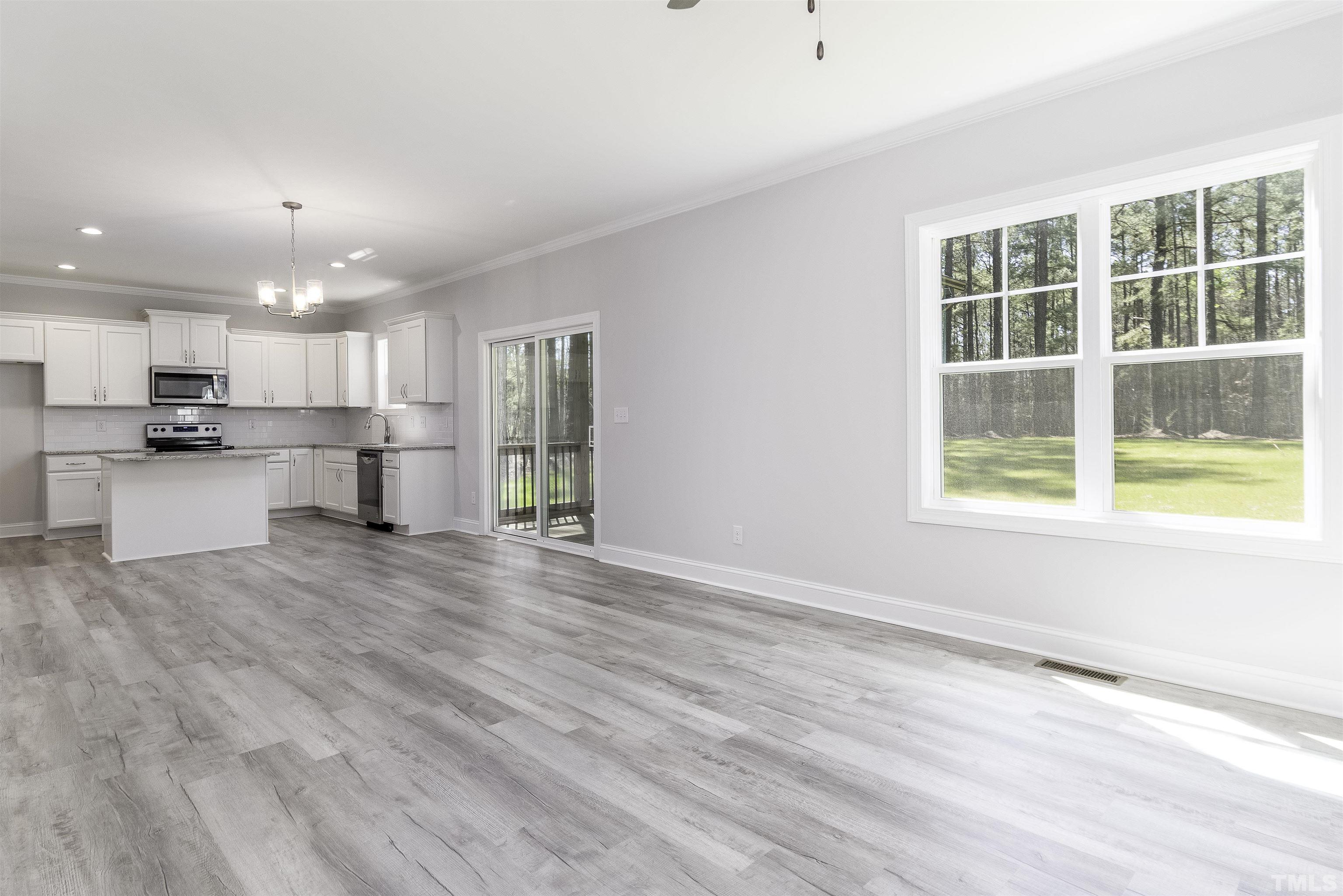 2758 Sledge Road Louisburg, NC 27549 - Photo 14 of 38 a view of a kitchen with a sink and a window