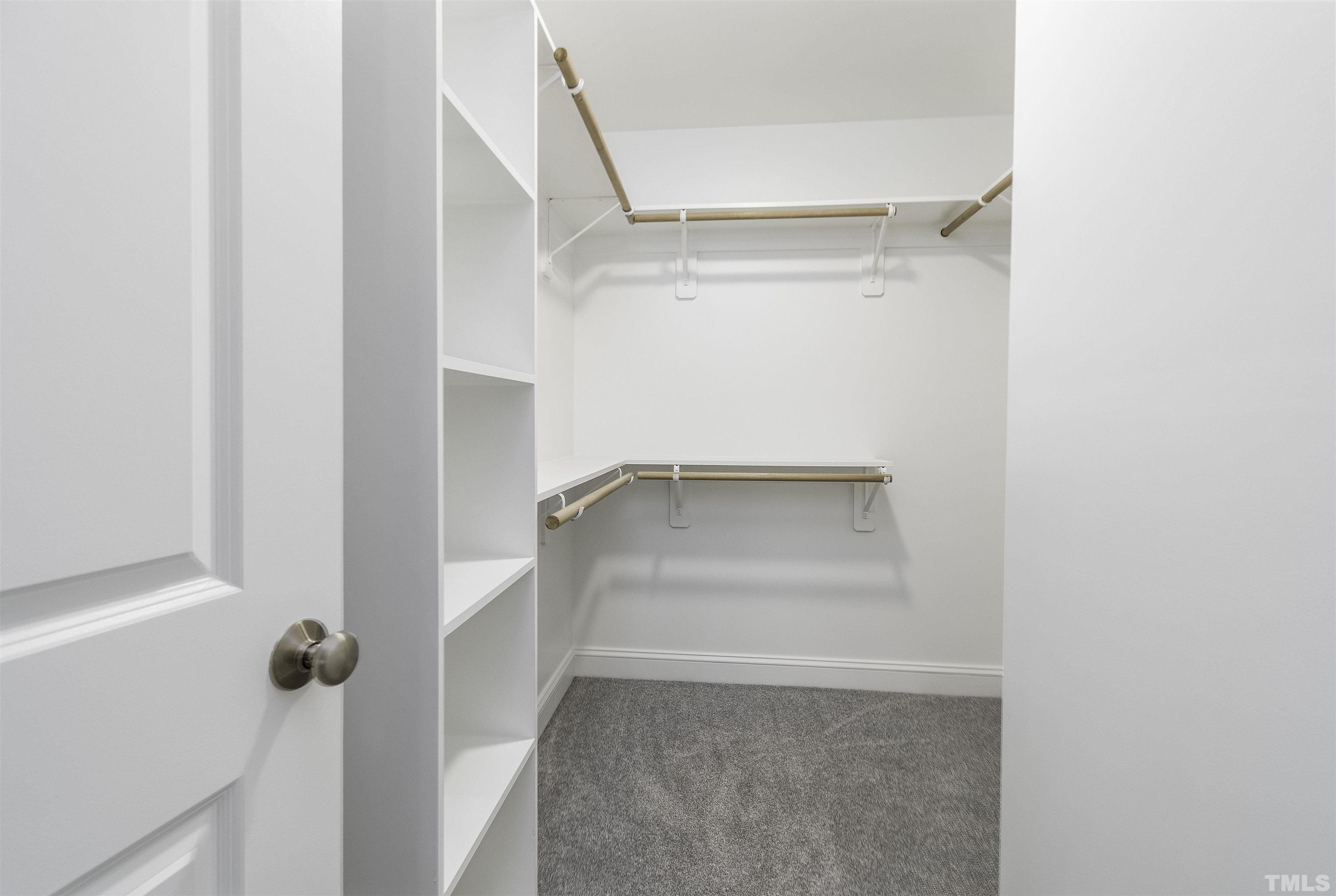 2758 Sledge Road Louisburg, NC 27549 - Photo 17 of 38 a view of walk in closet with clothes