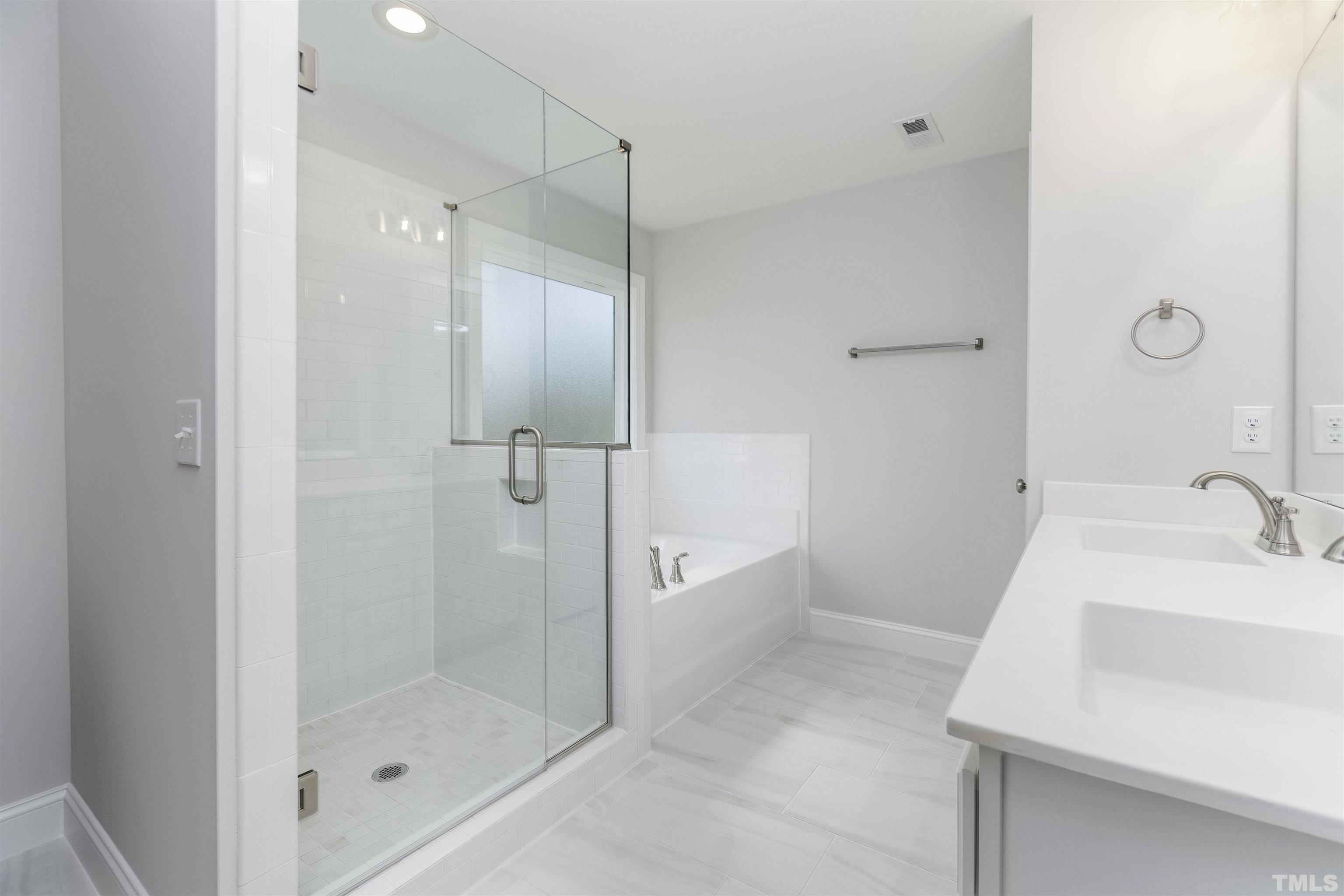 2758 Sledge Road Louisburg, NC 27549 - Photo 18 of 38 a bathroom with a shower and a sink