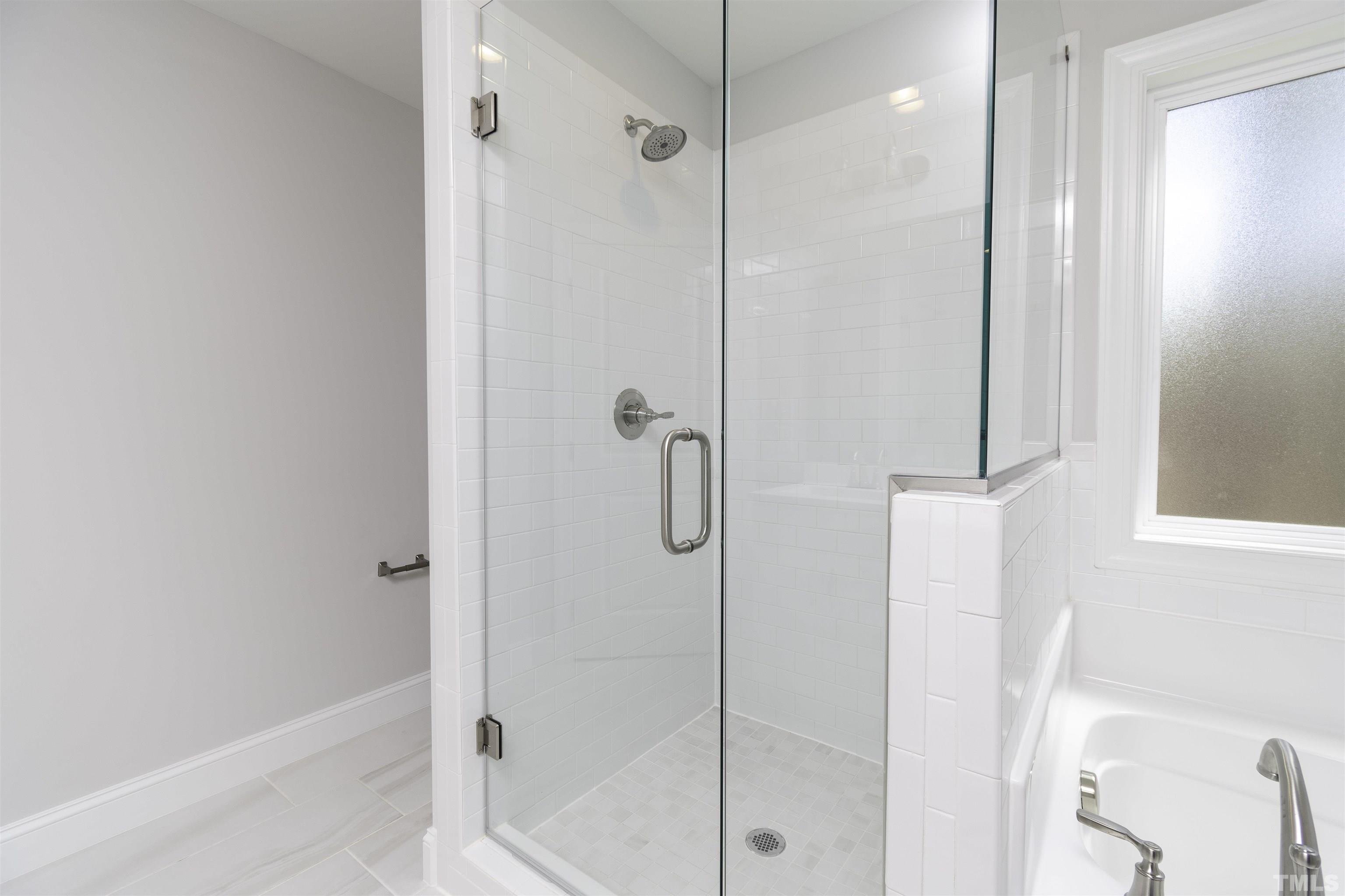 2758 Sledge Road Louisburg, NC 27549 - Photo 20 of 38 a bathroom with a shower and a glass door