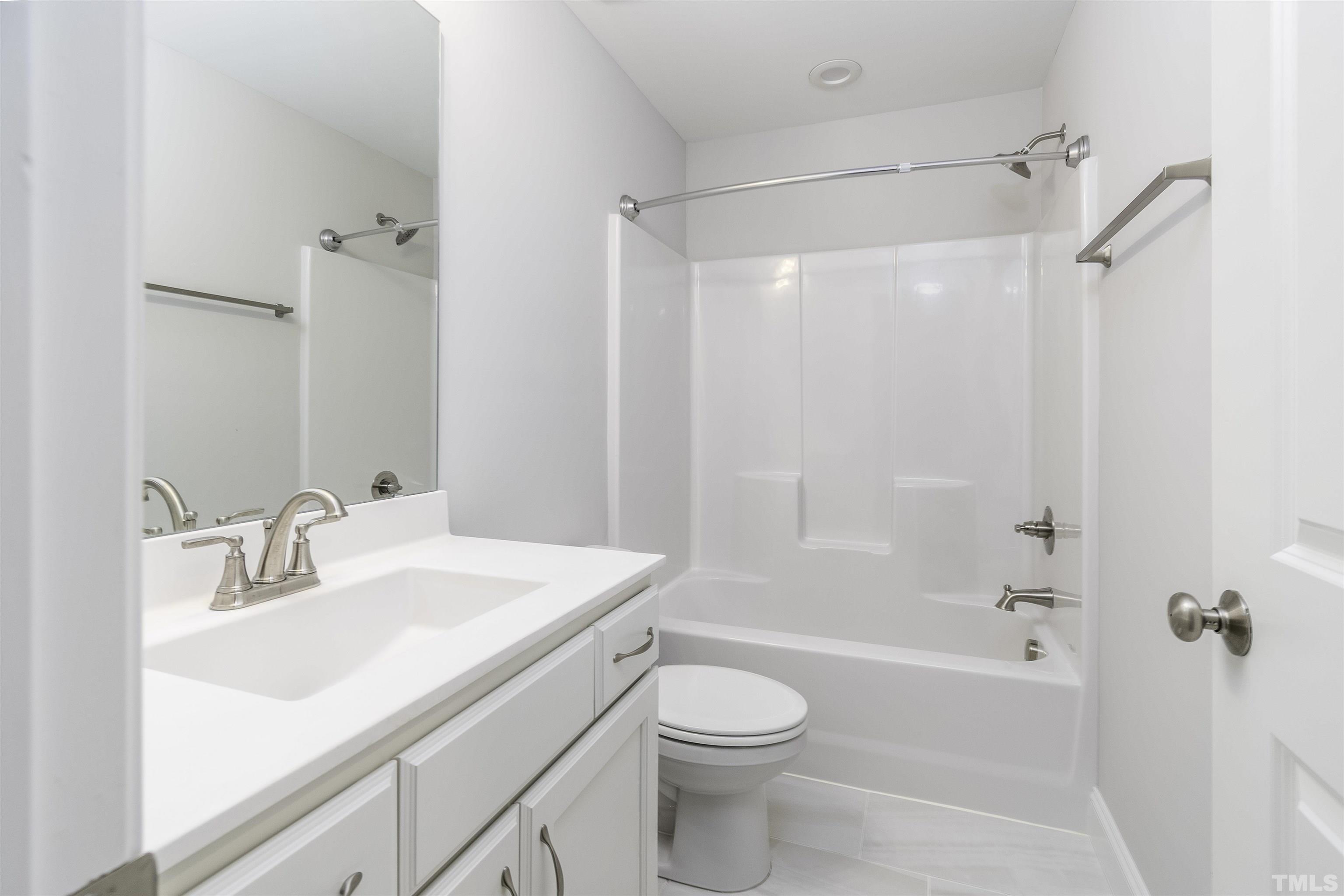 2758 Sledge Road Louisburg, NC 27549 - Photo 22 of 38 a bathroom with a sink toilet and shower