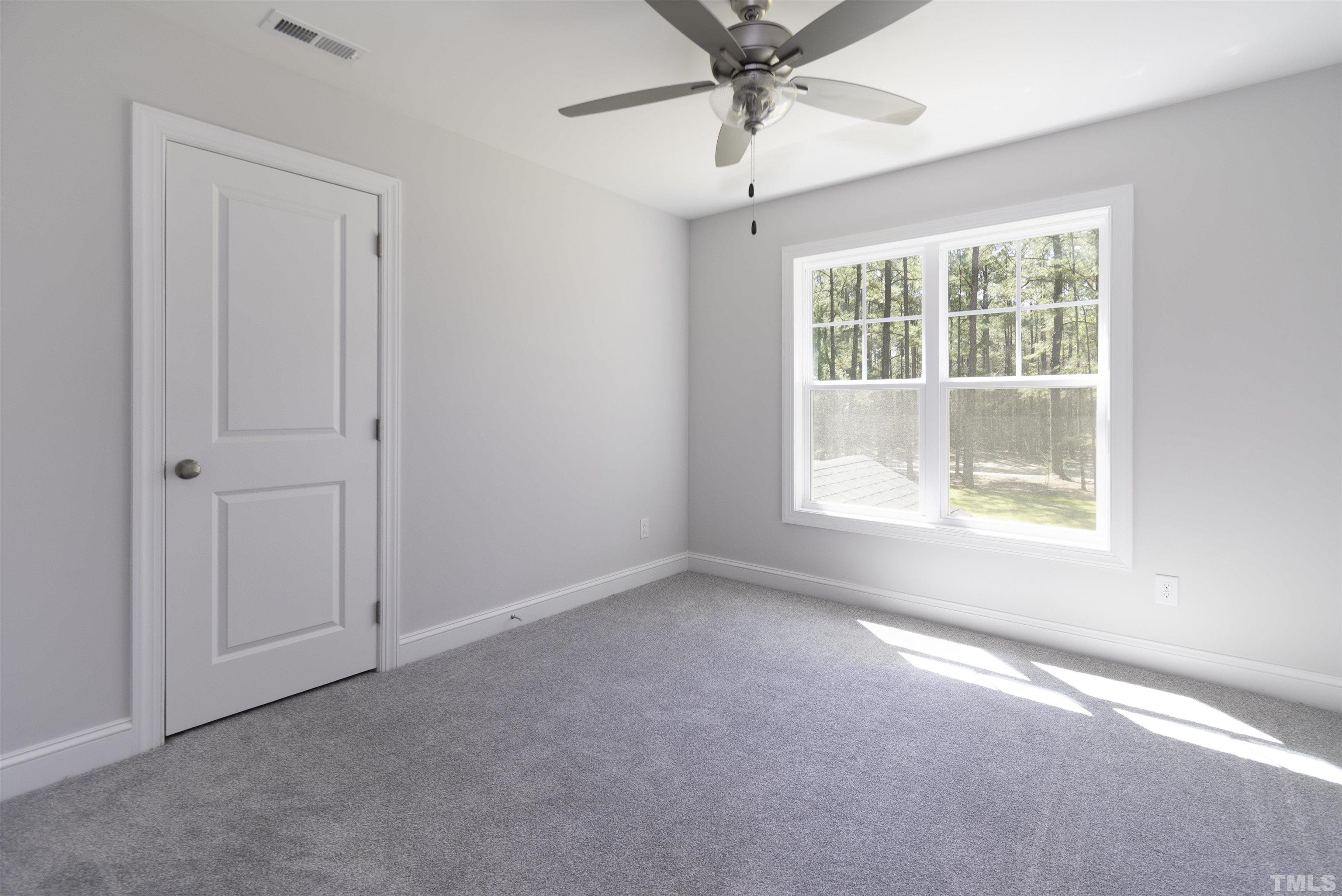 2758 Sledge Road Louisburg, NC 27549 - Photo 23 of 38 an empty room with a window