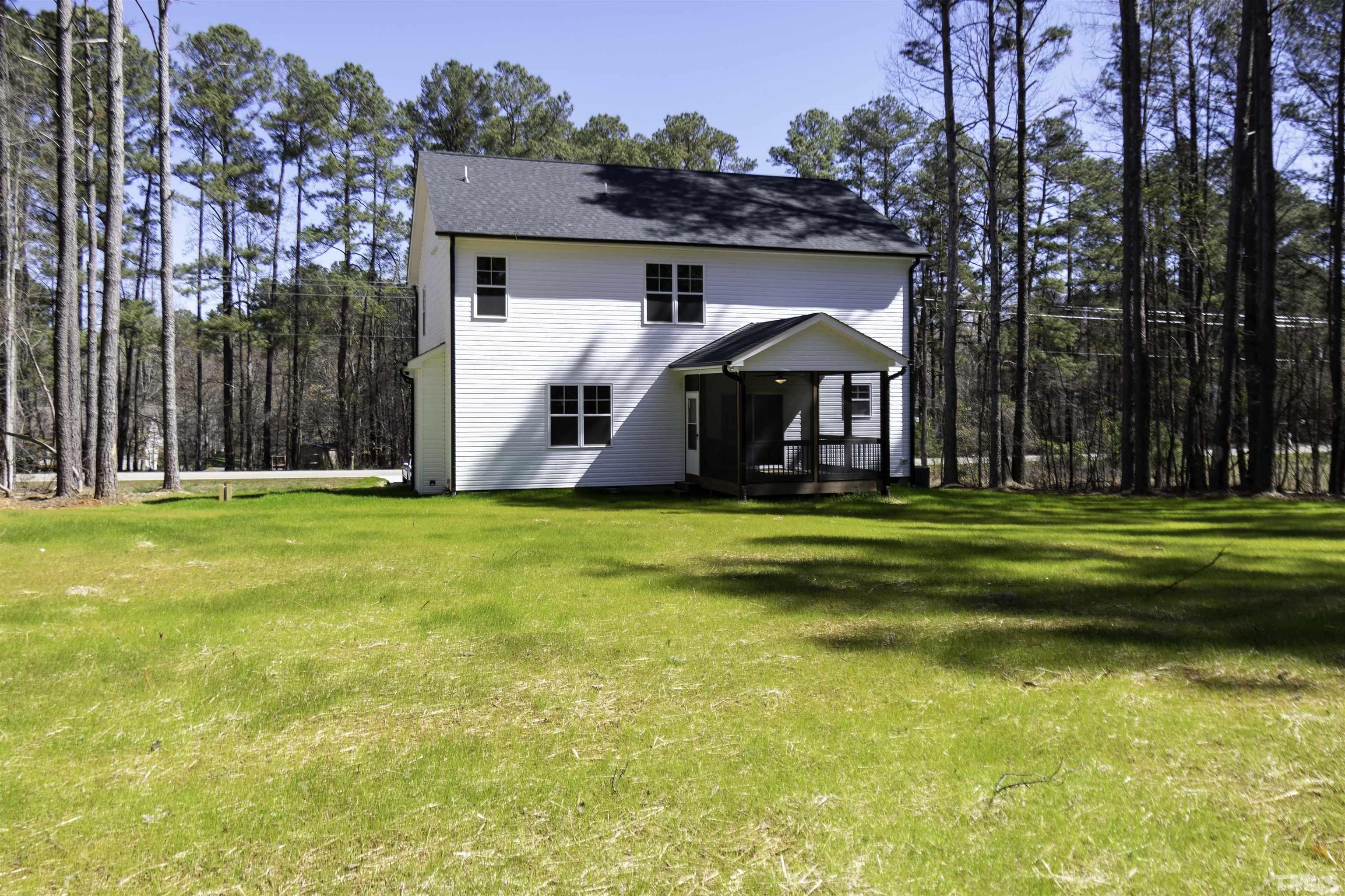 2758 Sledge Road Louisburg, NC 27549 - Photo 3 of 38 a front view of house with yard and swimming pool
