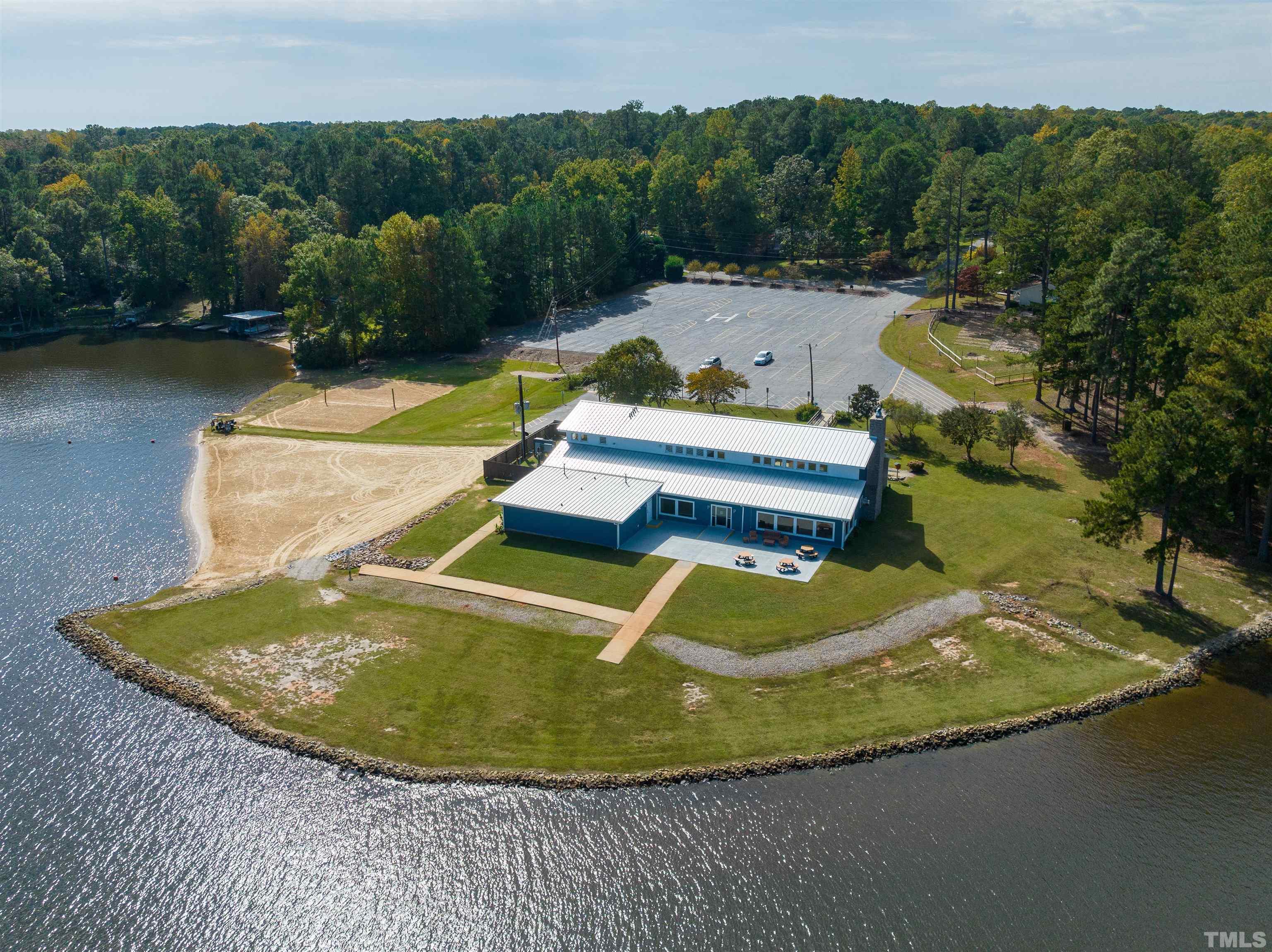 2758 Sledge Road Louisburg, NC 27549 - Photo 38 of 38 a view of a swimming pool with a yard and large trees