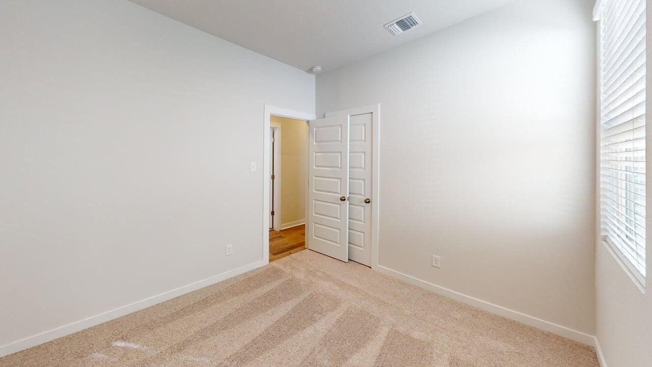 201 Firefox Way Jarrell, TX 76537 - Photo 11 of 27 Empty room with carpet and baseboards