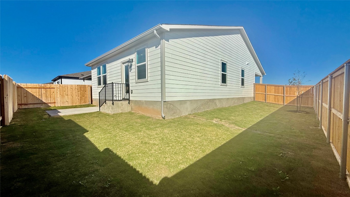 201 Firefox Way Jarrell, TX 76537 - Photo 21 of 27 View of home's exterior with a fenced backyard