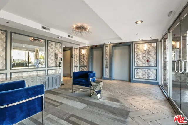 a bedroom with furniture and large window