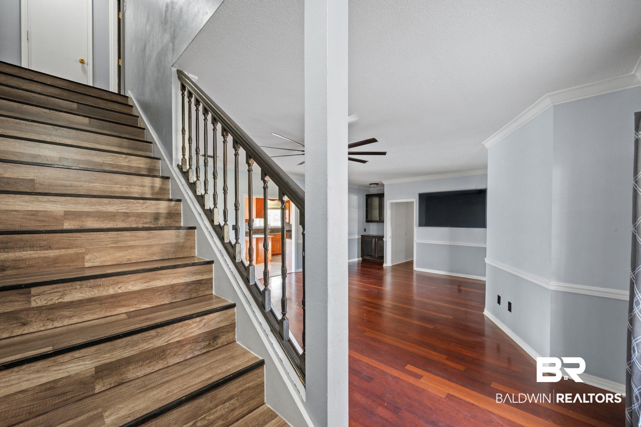 100 Orleans Way Daphne, AL 36526 - Photo 9 of 31 Stairs featuring ceiling fan, wood-type flooring, and ornamental molding