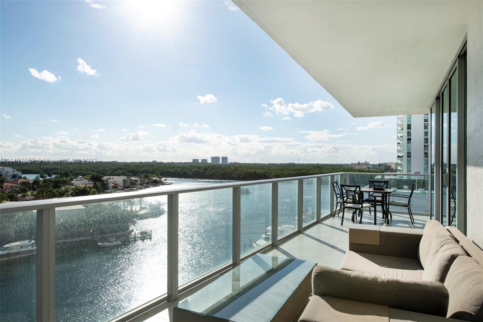 a view of a balcony with furniture