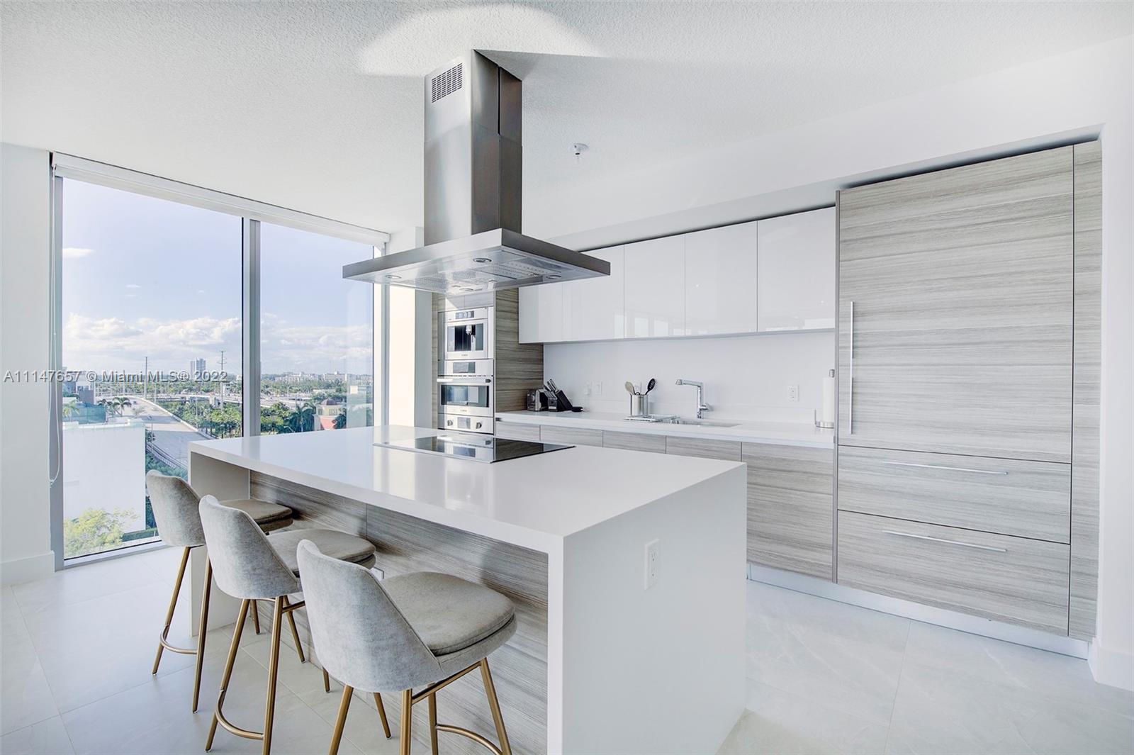 330 Sunny Isles Boulevard, Unit 5802 Sunny Isles Beach, FL 33160 - Photo 11 of 34 a kitchen with a sink cabinets and appliances
