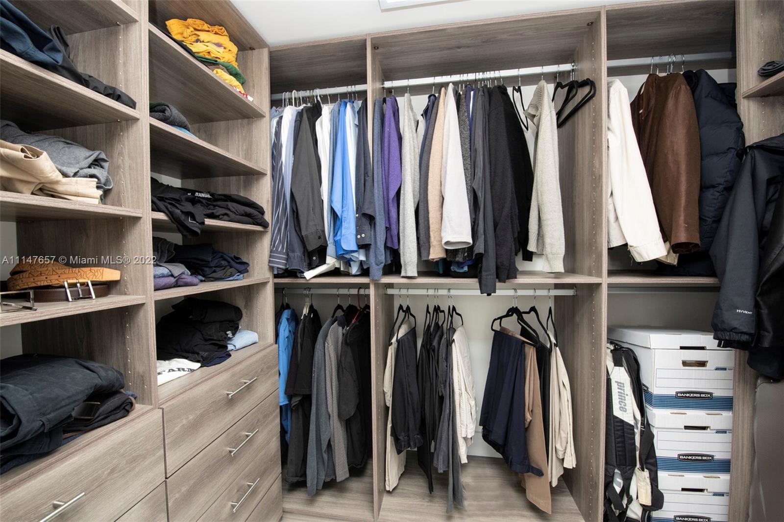330 Sunny Isles Boulevard, Unit 5802 Sunny Isles Beach, FL 33160 - Photo 17 of 34 a view of walk in closet with clothes and shoes