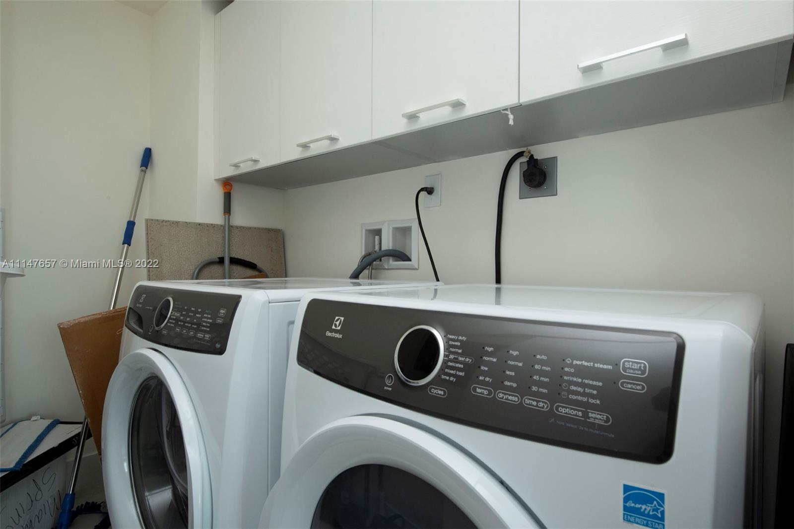 330 Sunny Isles Boulevard, Unit 5802 Sunny Isles Beach, FL 33160 - Photo 23 of 34 a view of washer and dryer