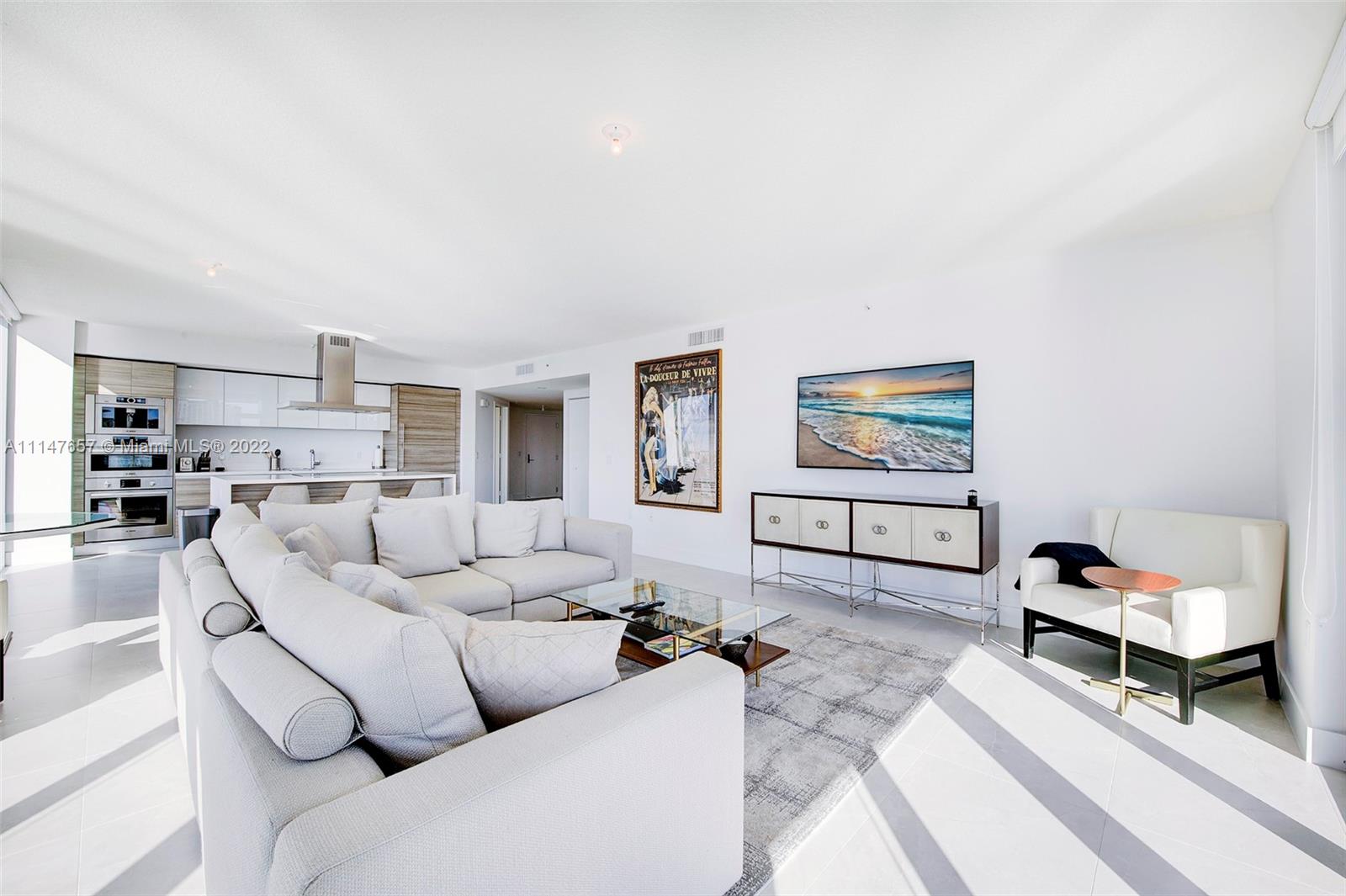 330 Sunny Isles Boulevard, Unit 5802 Sunny Isles Beach, FL 33160 - Photo 8 of 34 a living room with furniture and a couch