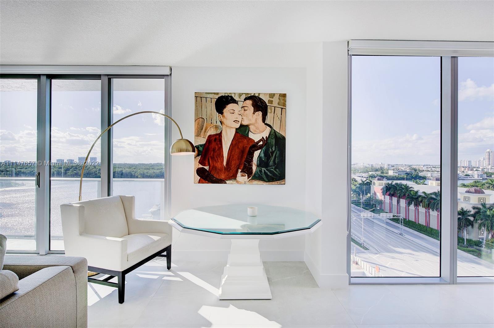 330 Sunny Isles Boulevard, Unit 5802 Sunny Isles Beach, FL 33160 - Photo 10 of 34 a living room with furniture and a painting on the wall