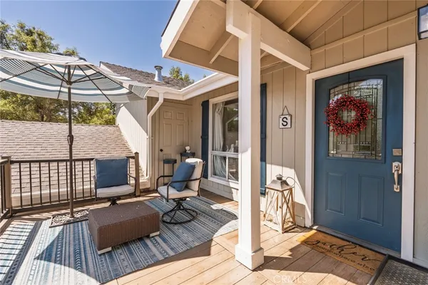 a view of a dinning table and chairs in patio of the house