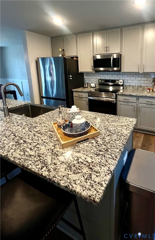 2267 Carys Creek Rd Fork Union Fork Union, VA 23055 - Photo 13 of 25 a kitchen with kitchen island granite countertop a sink stove and refrigerator