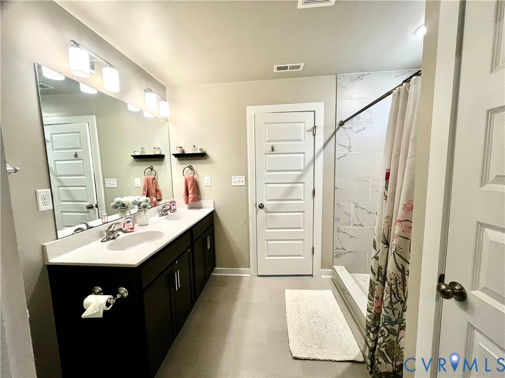 2267 Carys Creek Rd Fork Union Fork Union, VA 23055 - Photo 19 of 25 a bathroom with a sink vanity granite tub and shower
