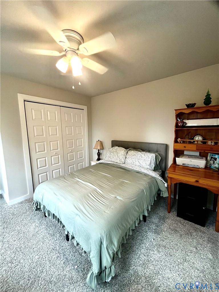2267 Carys Creek Rd Fork Union Fork Union, VA 23055 - Photo 21 of 25 a bedroom with a bed and a chandelier