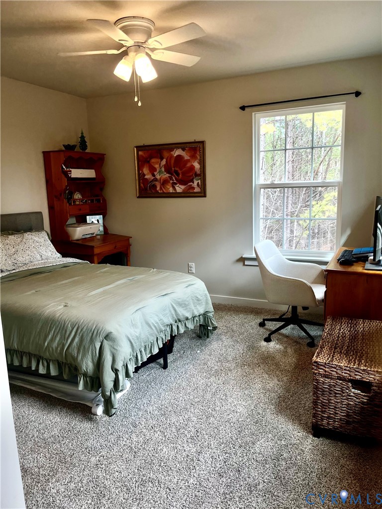 2267 Carys Creek Rd Fork Union Fork Union, VA 23055 - Photo 22 of 25 a spacious bedroom with a bed and a window