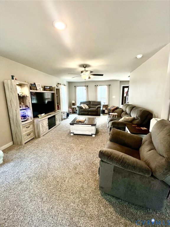 2267 Carys Creek Rd Fork Union Fork Union, VA 23055 - Photo 7 of 25 a living room with furniture and a white kitchen