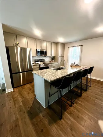 a kitchen with a dining table and chairs