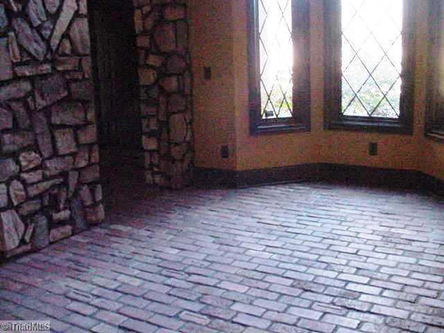 260 Slater Road Lewisville, NC 27023 - Photo 6 of 7 Other. Living area with brick flooring!